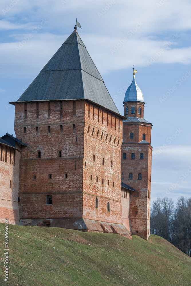 The ancient Pokrovskaya and Kokuy towers of the Novgorod Kremlin close-up on a April afternoon. Veliky Novgorod, Russia