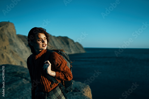 cheerful woman hiker outdoors rocky mountains adventure landscape