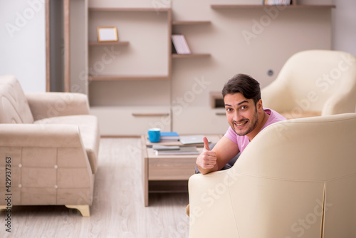 Young man siiting at home during pandemic photo