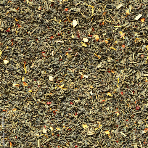 Seamless pattern of green tea leaves with the addition of dry fruits as flavors on a flat surface. Minsk. Belarus.  photo