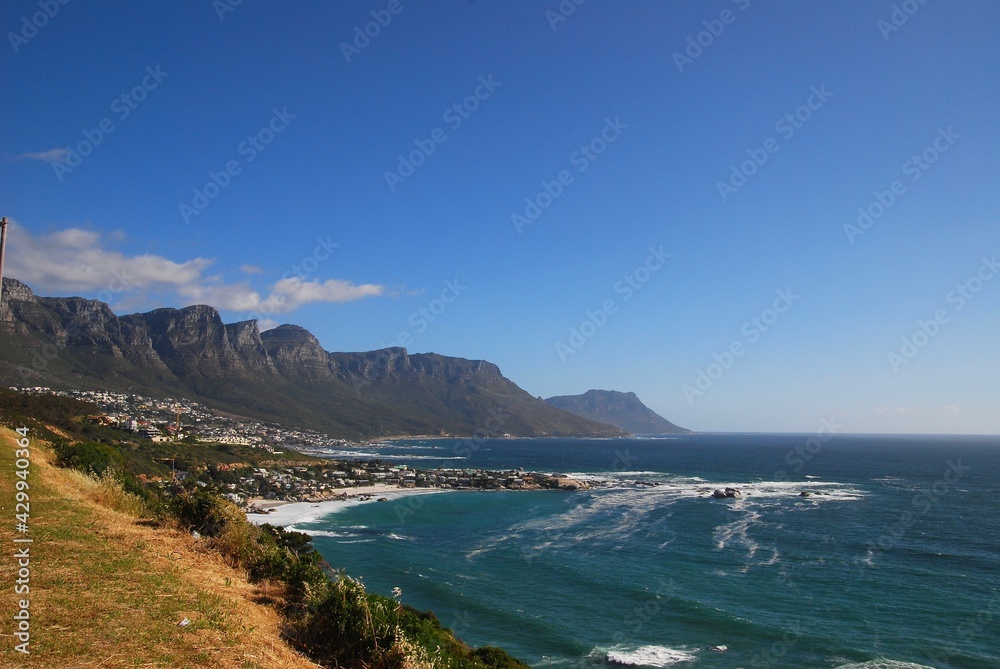 View of the Table Mountain National Park (known as apostles) from Signal Hill in Cape Town, on a sunny day, blue sky, few clouds