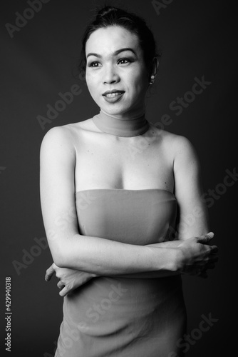 Happy young beautiful Asian transgender woman smiling