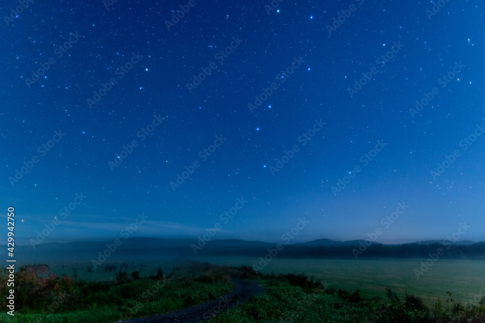 Big dipper on meadow and farm road in hokkaido japan