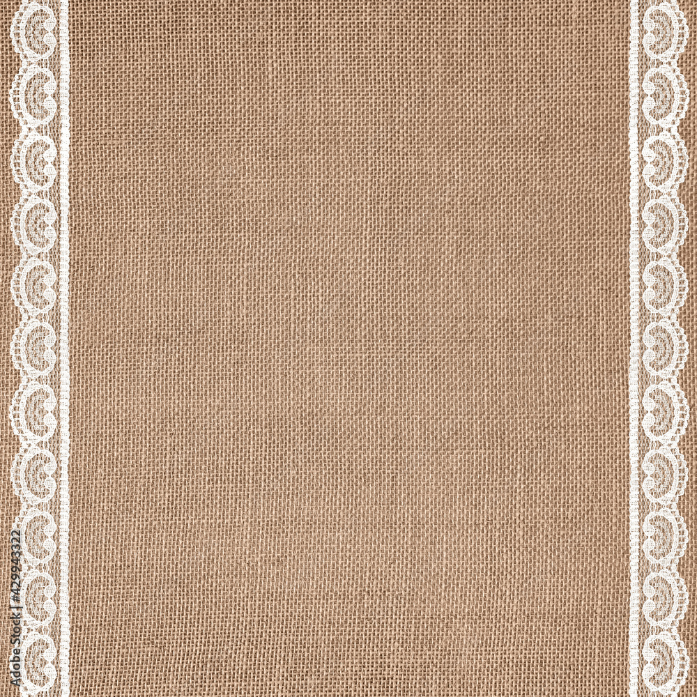 Fototapeta premium Off-White Lace on Brown Burlap Texture