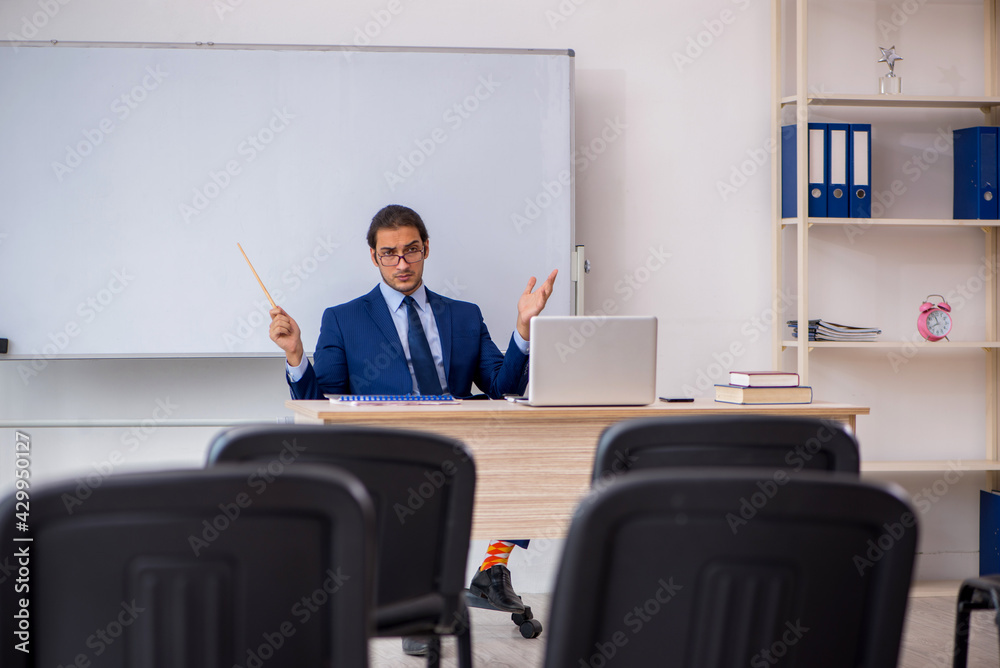Young male business trainer in the office during pandemic Young male business trainer in the office during pandemic