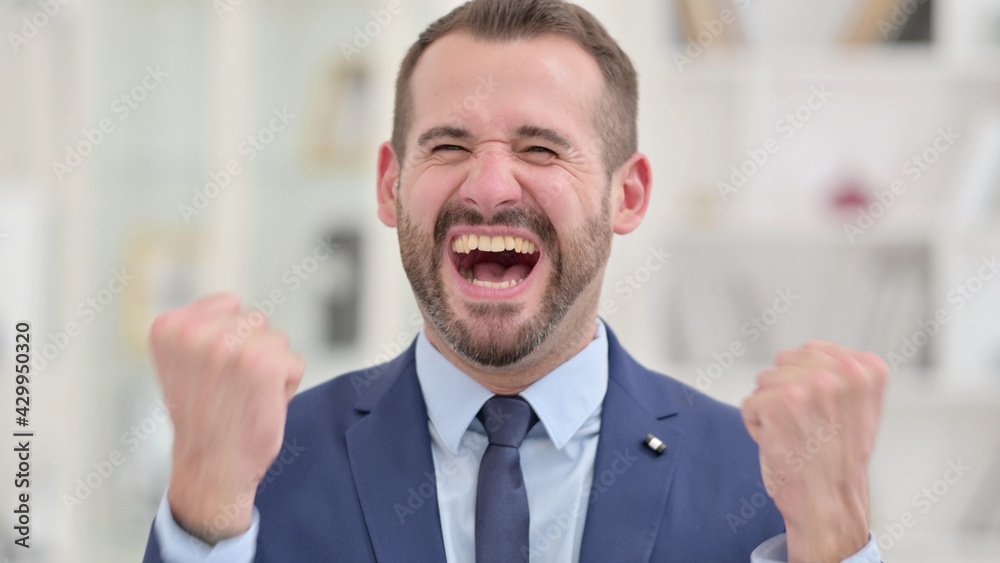 Portrait of Ambitious Businessman Celebrating Success Portrait of Ambitious Businessman Celebrating Success