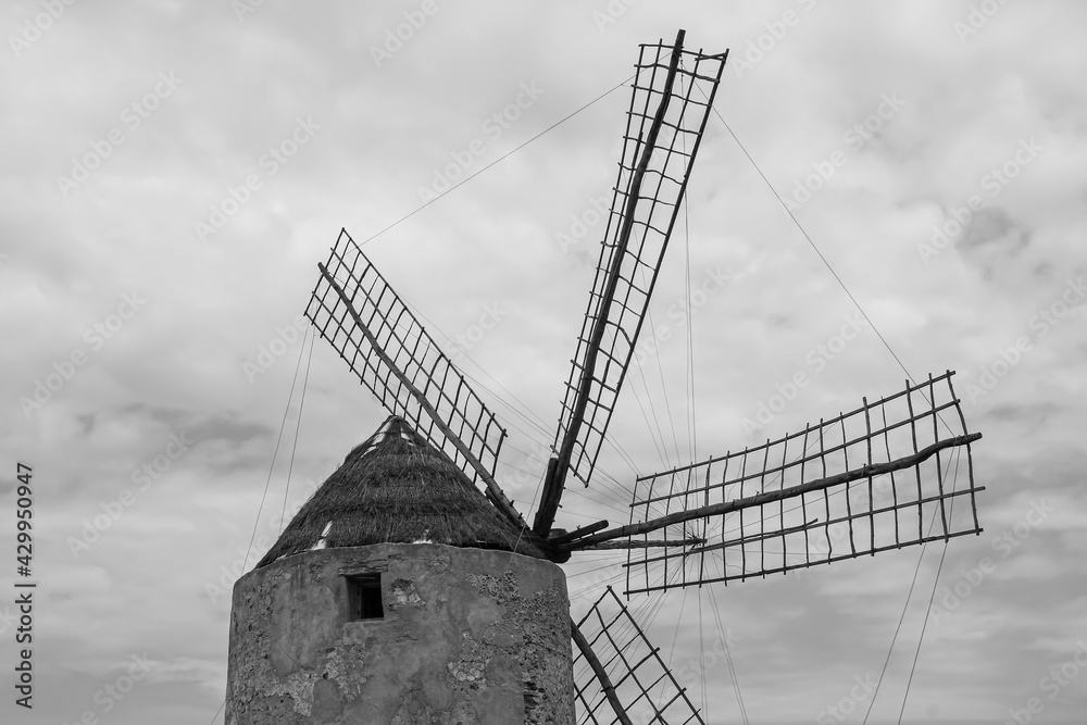 black and white of an old, abandoned windmill