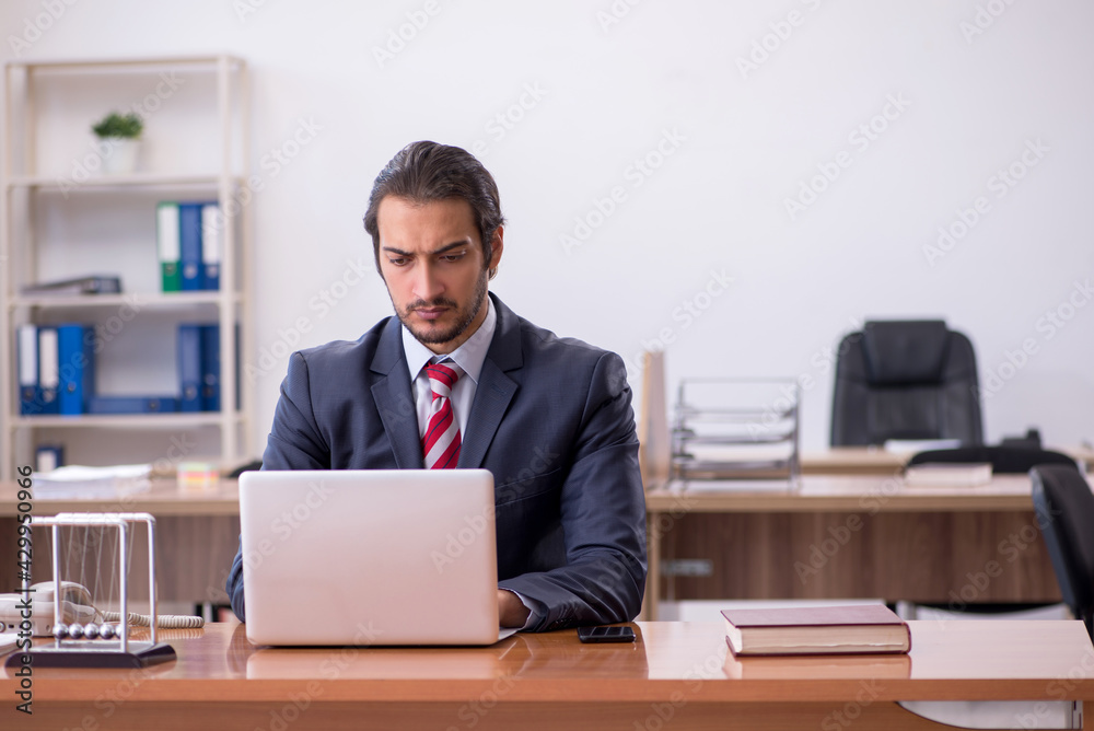 Young man businessman employee sitting in the office Young man businessman employee sitting in the office
