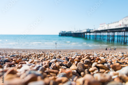 Fototapeta Naklejka Na Ścianę i Meble -  Brighton Beach with gravel beach, ocean and pier