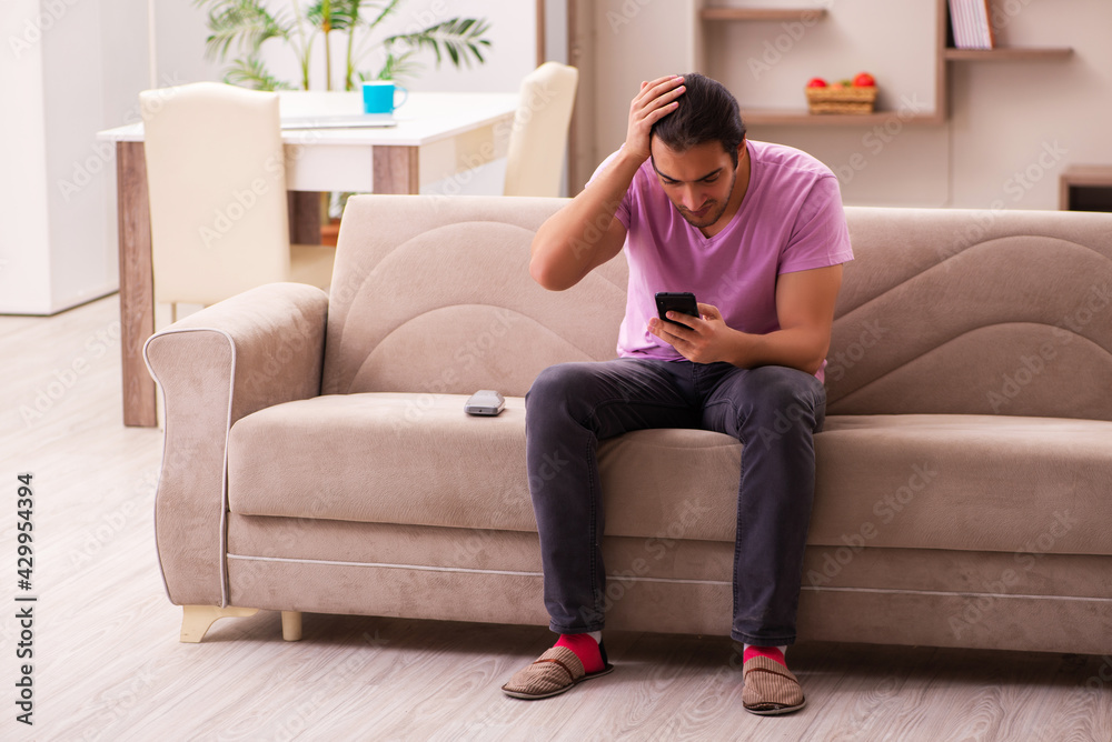Young man staying at home during pandemic Young man staying at home during pandemic