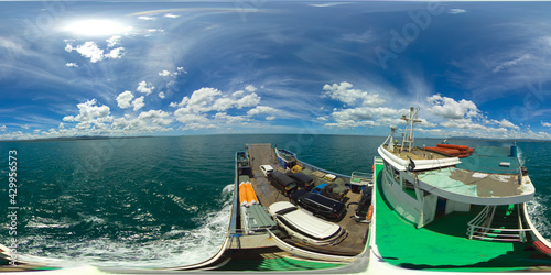 Passenger ferry at sea among tropical islands. Virtual Reality 360. Ferry service Lipata to San Ricardo, Philippines. 360 panorama VR.
