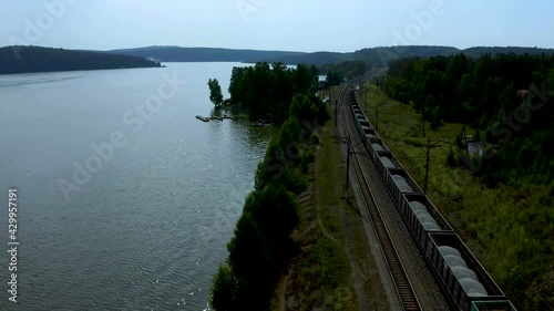 Wallpaper Mural freight train with coal in the woods on the lake, nature of the Urals, transport delivery by rail Torontodigital.ca