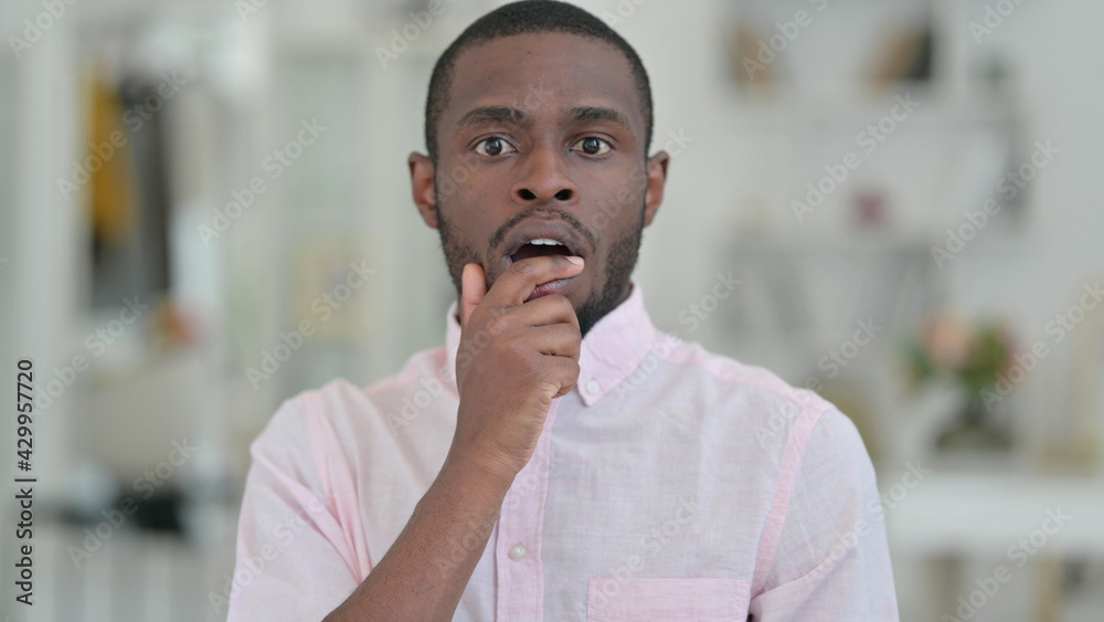 Naklejka premium Portrait of Upset African Man Feeling Shocked 