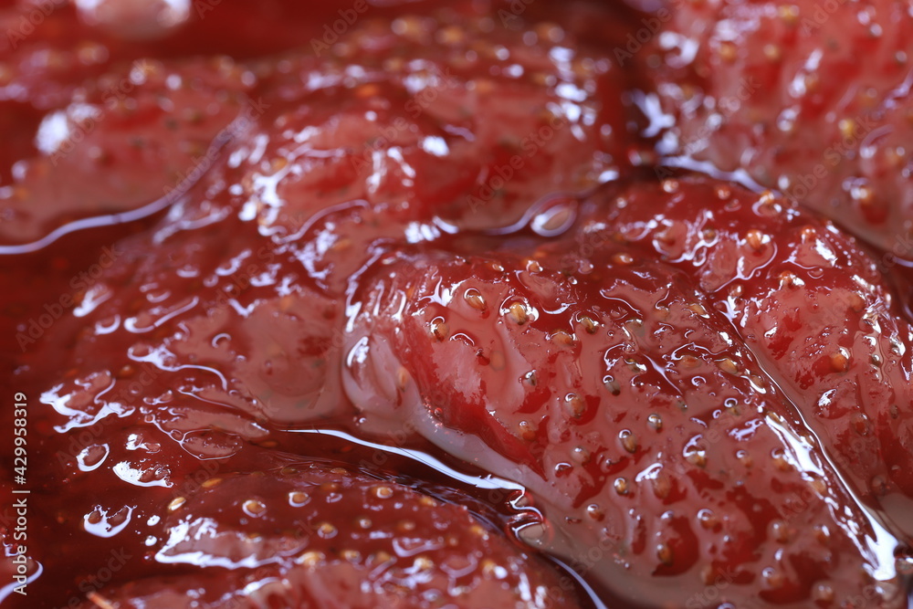 Strawberry jam made from natural strawberries in a white bowl Strawberry jam made from natural strawberries in a white bowl