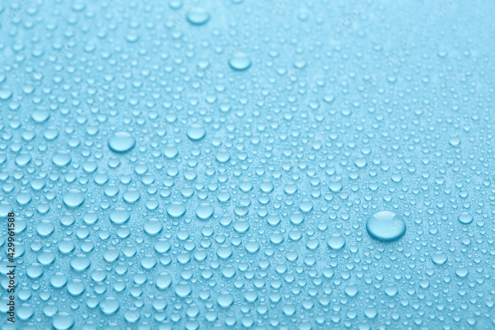 Pure water drops texture or clear background. Blue abstract background. Fresh water droplets.