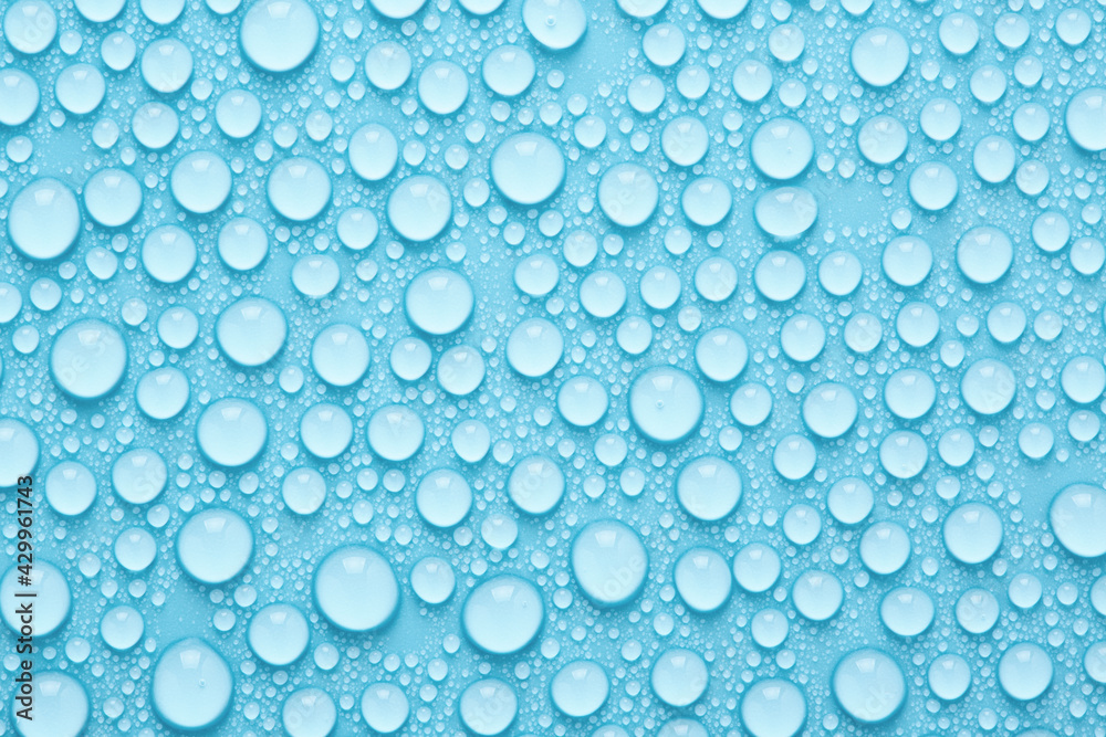 Water drops texture on blue background. Abstract background with pure droplets pattern. Water drops texture on blue background. Abstract background with pure droplets pattern.