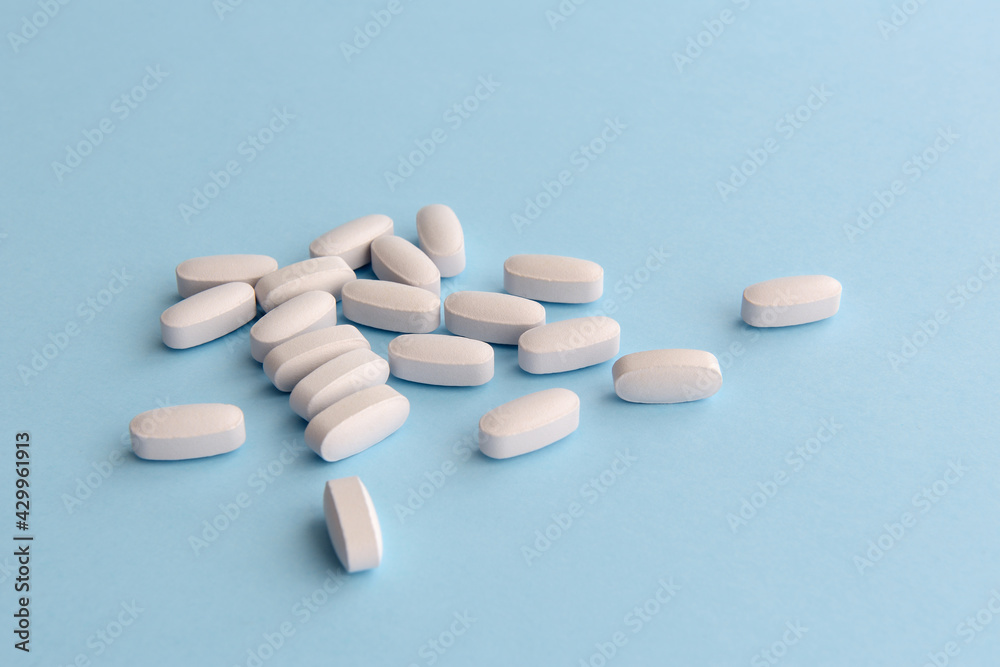 White pills. Copy space for text. White pills. Copy space for text.