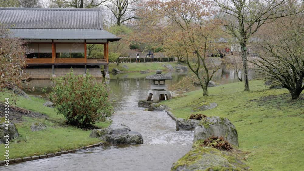 Traditional ceremony tea house in the Japanese garden - wide angle Traditional ceremony tea house in the Japanese garden - wide angle