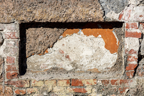 фотографія an old stone wall with a deepening rectangular shape