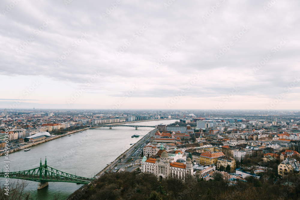 Aerial view of old buildings and bridges on the waterfront in Budapest