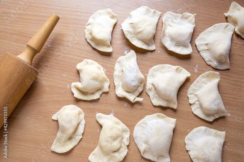Raw dumplings on a board. Traditional homemade food