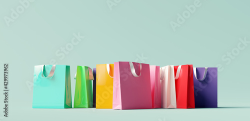Colorful shopping bag on pastel green background. 3d rendering
