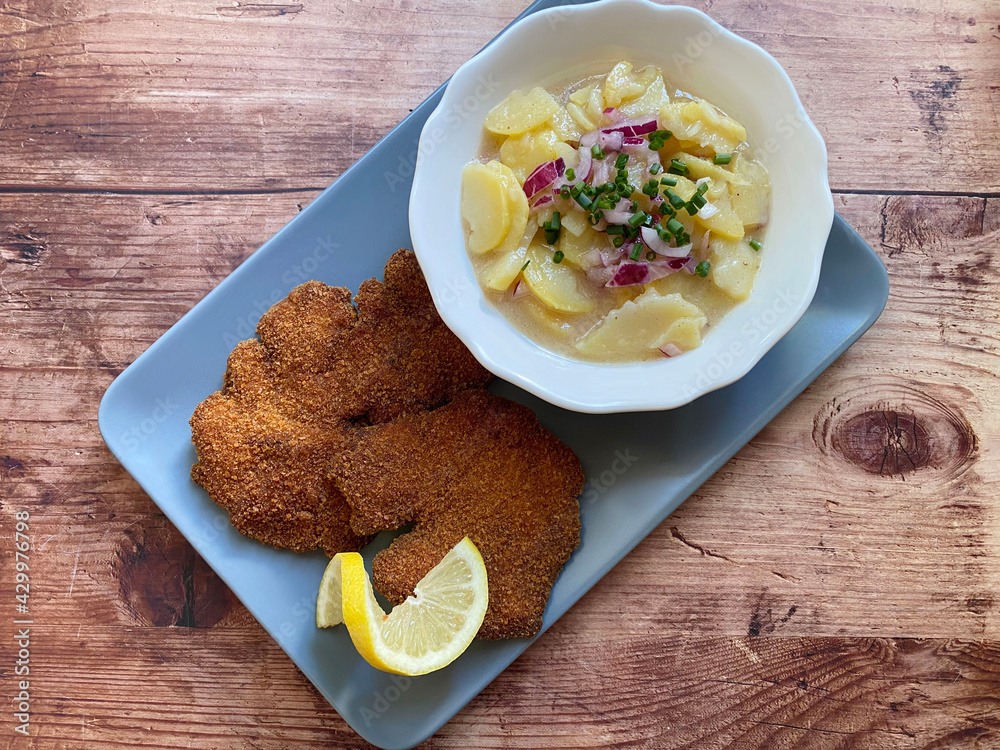 Classic breaded chicken livers with potato salad. The potato salad is