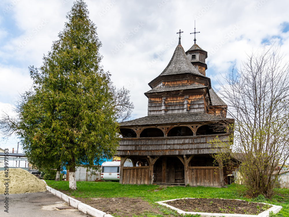 Obraz premium The Church of Holy Cross at Drohobych, Ukraine. The typical example for the Wooden Churches of the Carpathian Region.