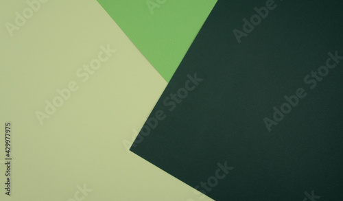 Beige, light and dark green colored blank geometric paper abstract background.