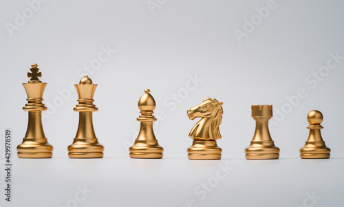 Fotografia, Obraz Golden chess include king queen horse ship and pawn on white background
