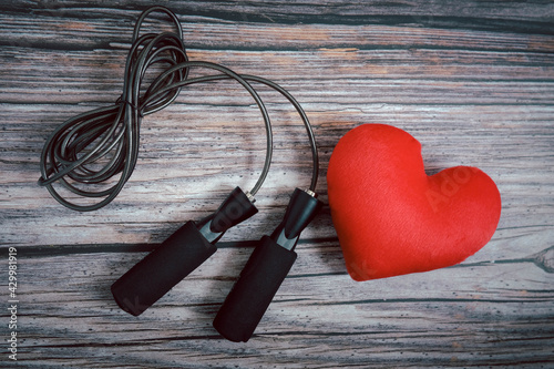 Jump rope and red heart  one the table