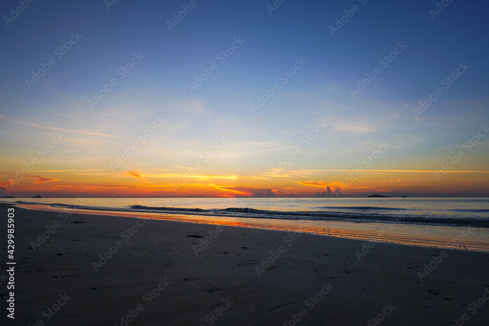Colorful ocean beach during dawn in summer with deep blue sky at Hatwanakorn National park in Prachuap Khiri Khan province Thailand.