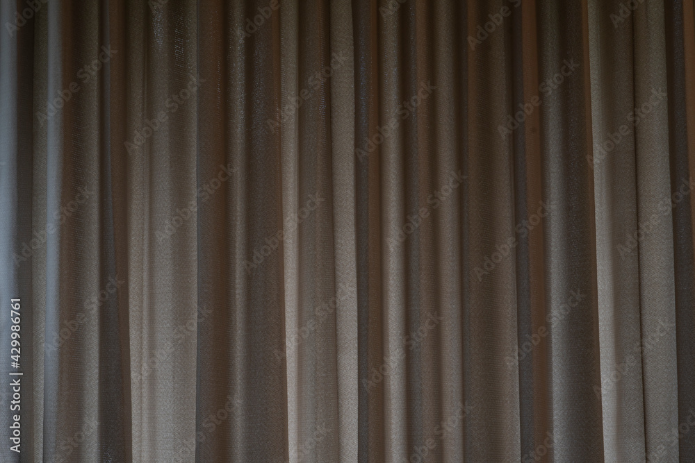 Covered curtains with light brown creases. Covered curtains with light brown creases.