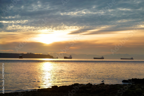 Sunset on sea. Landscape with ships on sunset sea