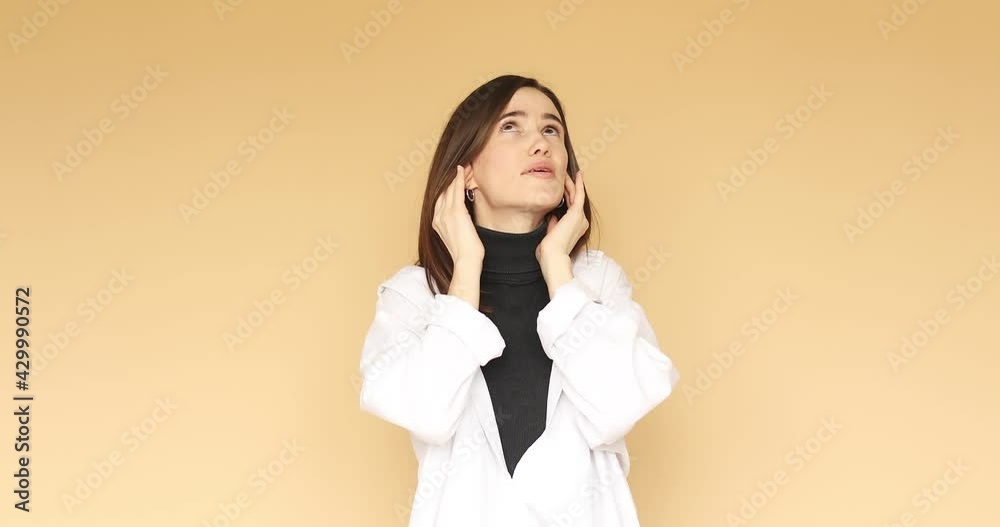 Annoyed caucasian woman closing ears with hands and saying bla bla. Disagreement, negativism, sarcasm, anger. Look camera covering ears with hands say blah blah blah do not wanna listen. Annoyed caucasian woman closing ears with hands and saying bla bla. Disagreement, negativism, sarcasm, anger. Look camera covering ears with hands say blah blah blah do not wanna listen.