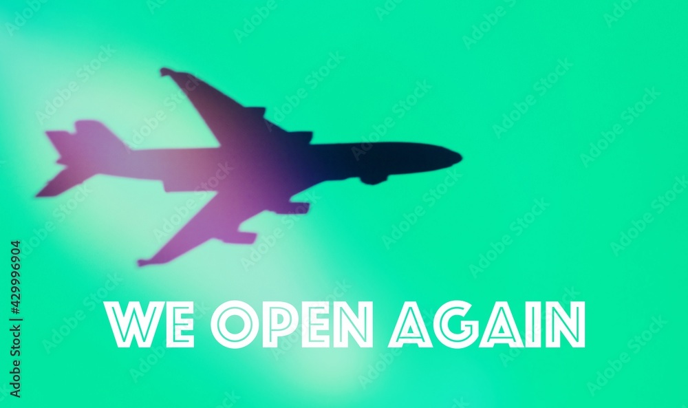 Shadow of an aircraft in a green background, with the text 