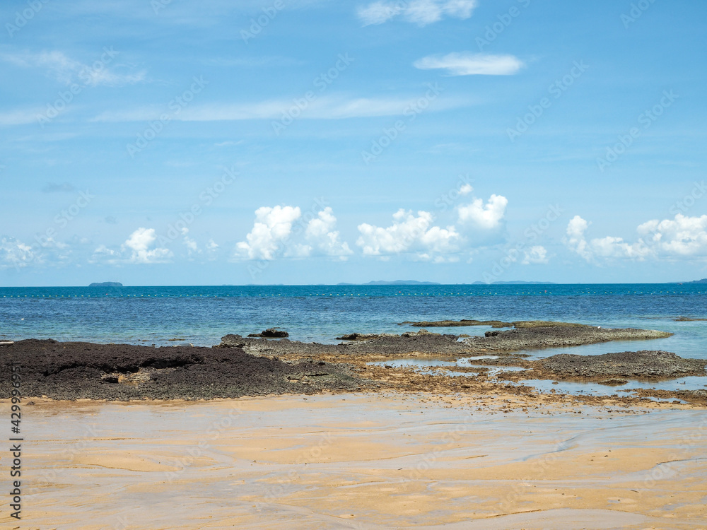 Beautiful blue sea beach. Against the sky and white clouds.