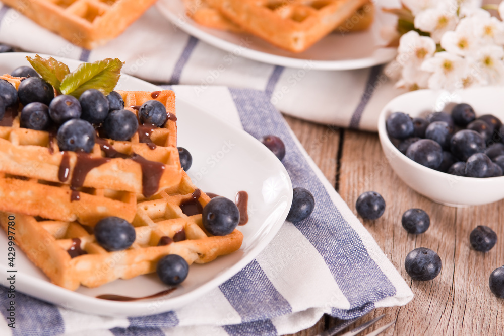 Waffles with blueberries and chocolate cream. Waffles with blueberries and chocolate cream.
