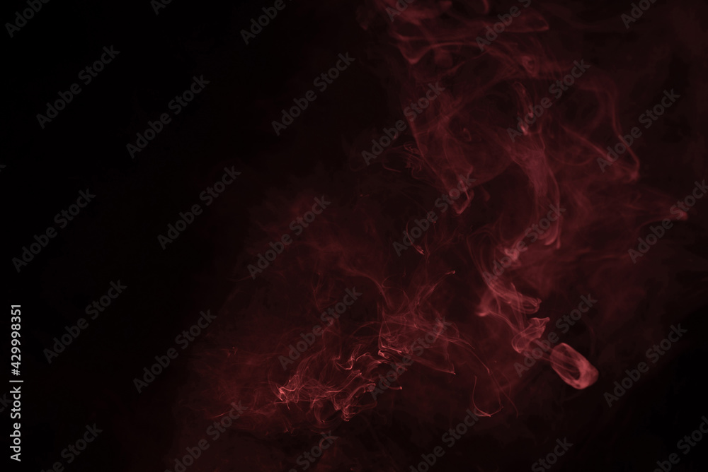 Fototapeta premium Yellow and pink steam on a black background.