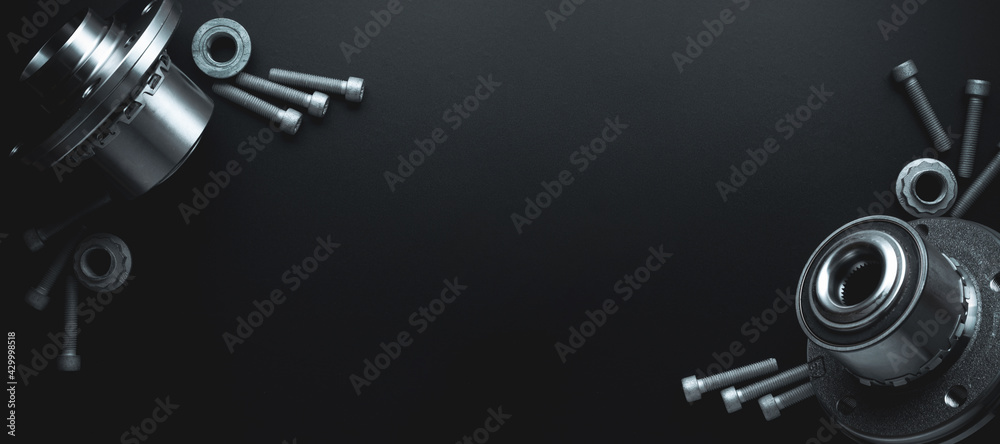 Spark plugs. Auto motor mechanic spare or automotive piece on dark banner background. Set of new metal car part. Flat lay, top view, copy space. Spark plugs. Auto motor mechanic spare or automotive piece on dark banner background. Set of new metal car part. Flat lay, top view, copy space.