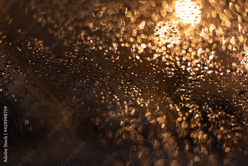 Blurred background with raindrops and lights. Blurred background with raindrops and lights.