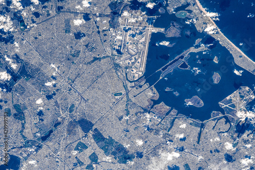 New York City is seen from space, year 2021. Digital enhancement by the artist. Elements of this image furnished by NASA photo