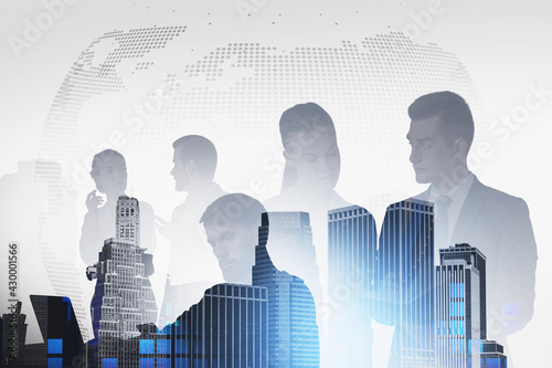Silhouette of businesspeople working on project, New York downto