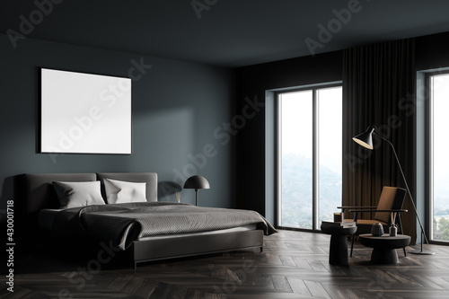 Dark bedroom interior with bed and armchair near window  mockup poster