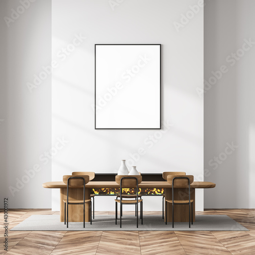 Living room interior with fireplace, poster, six chairs and table © ImageFlow