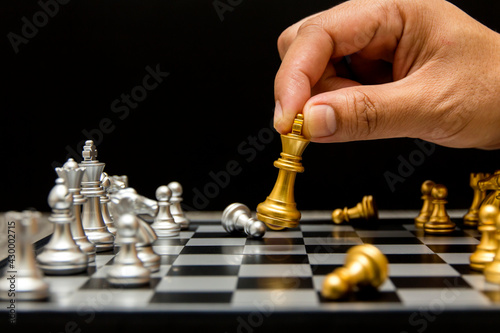 hand of man moving chess in chess competitions demonstrate leadership business and teamwork concept