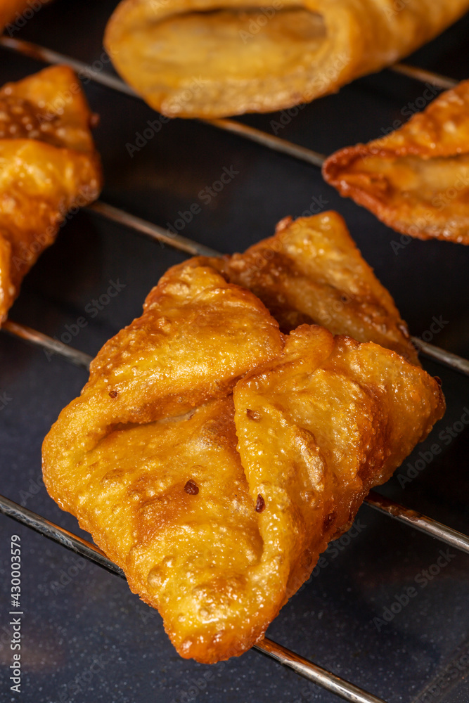 Fried sweets (pestiños) typical Spanish dessert from Andalusia and Extremadura. Fried sweets (pestiños) typical Spanish dessert from Andalusia and Extremadura.