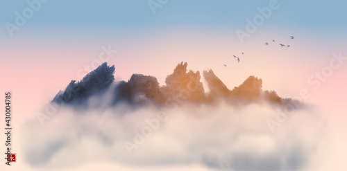 Wild rocky mountains in fog and flock of birds in sunrise sky. Traditional oriental ink painting sumi-e, u-sin, go-hua. Translation of hieroglyph - eternity.