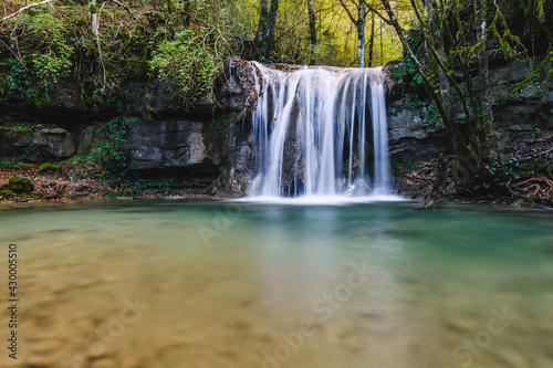 beautiful little waterfall in the forest