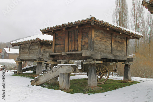 Detail of traditional granaries under the snow in the town of Prioro, Leon Spain photo